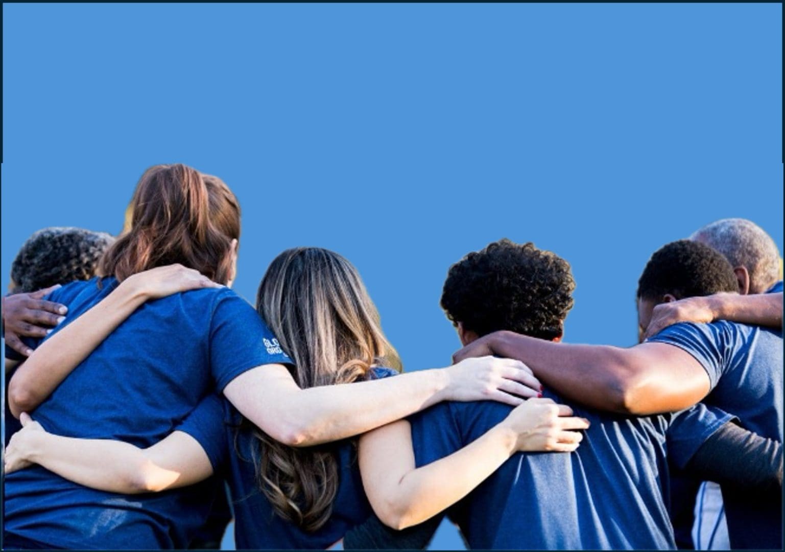 a group of volunteers in a huddle